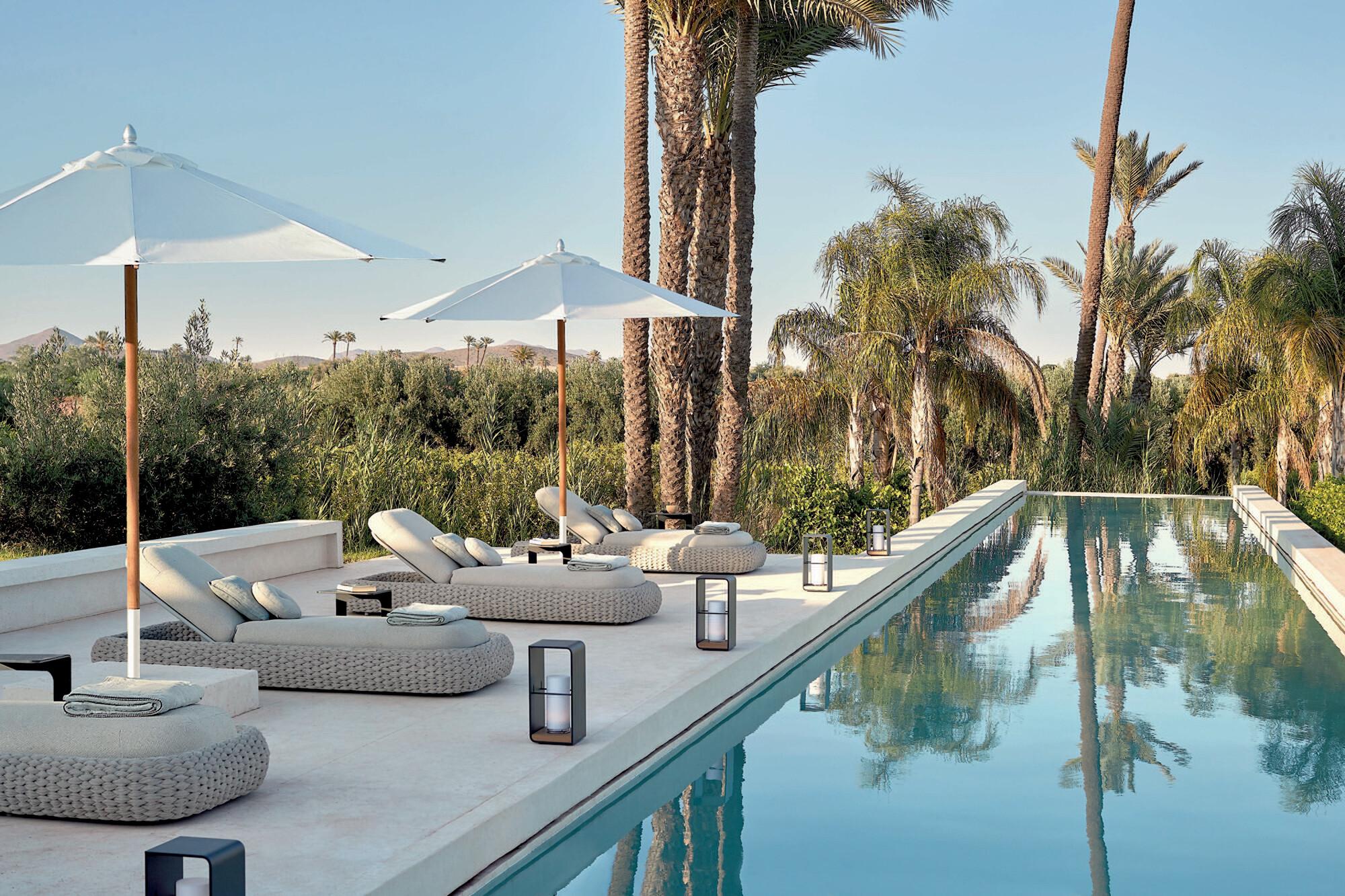 Kobo loungers, umbrellas and Flame Lumo by the pool